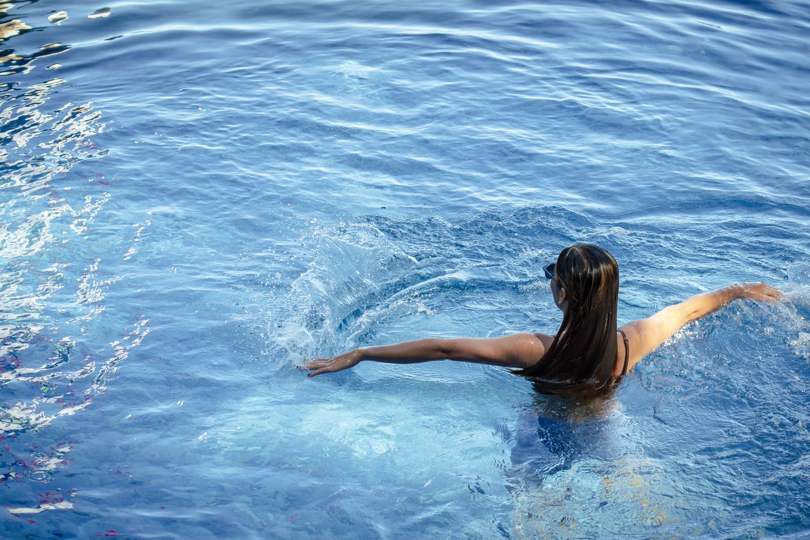 Guest splashing in the pool at Isola Vista Beach Resort, Batangas City
